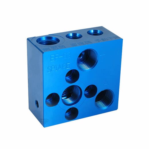 CNC machined aluminum block with blue anodizing