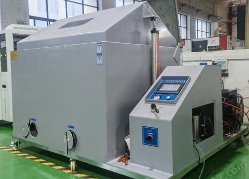 Salt spray testing machine validating corrosion resistance of plated and anodized parts